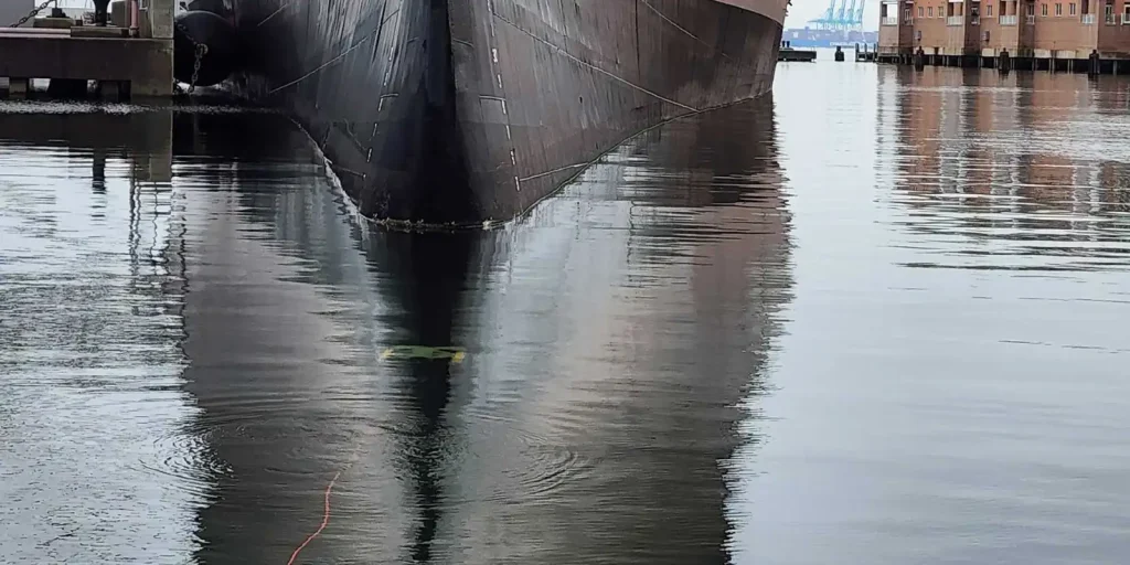 EverClean ship hull cleaning robot is approaching bow of naval ship