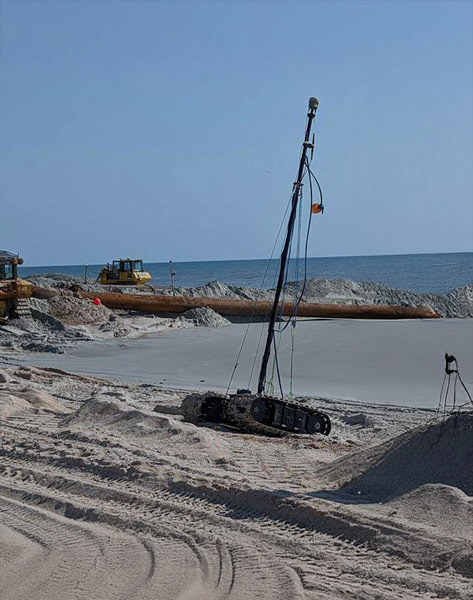 Bayonet AUGV kitted out with RTK Survey sensors shown during beach errosion mitigation
